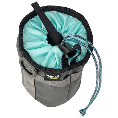 Charcoal stem bag with robin egg blue liner pulled closed. .