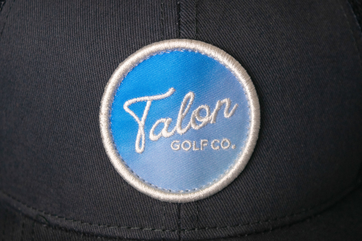 Fade to Blue Trucker Hat by Talon Golf LLC